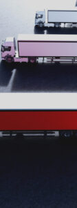 Fleet of new heavy trucks with one selected. Transport, shipping industry. 3D illustration